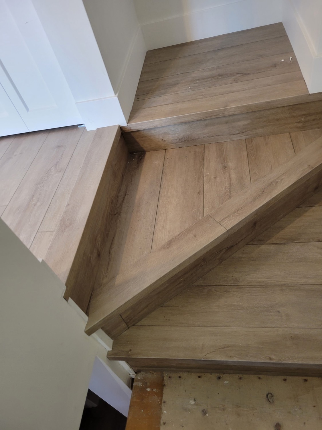 Custom wood-clad staircase with treads, stringers and landing