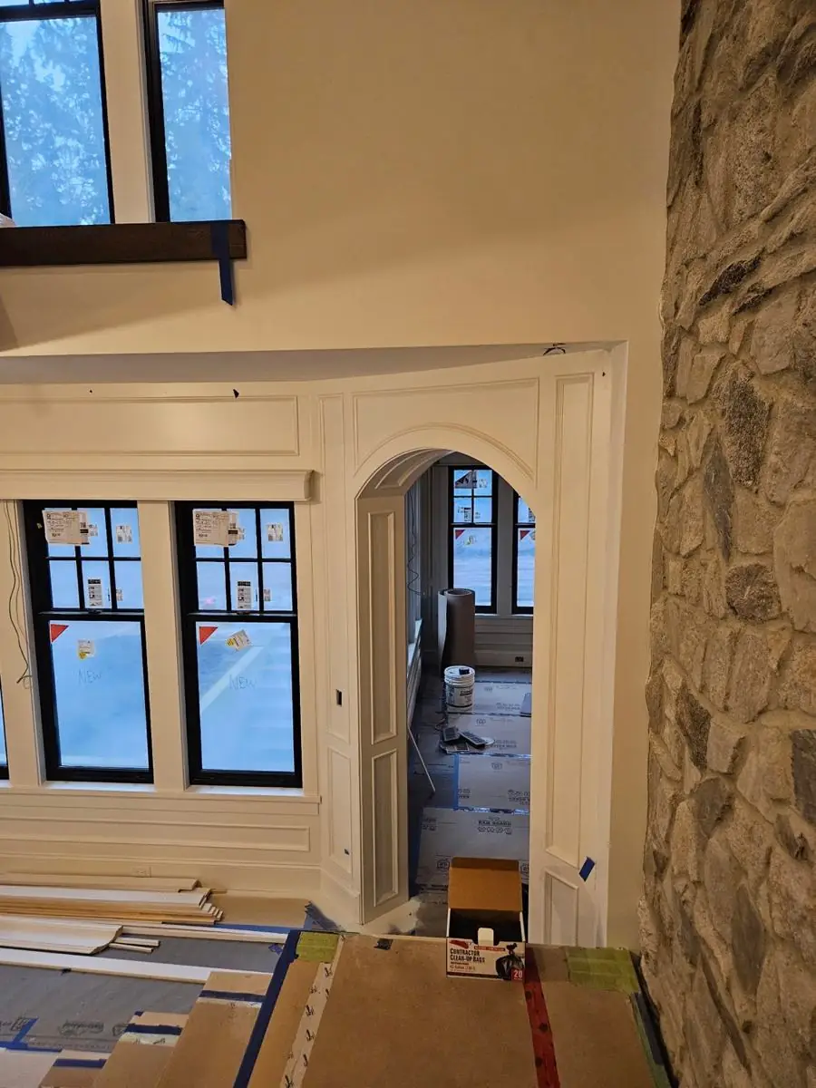 Arched interior doorway finished with casing and trim