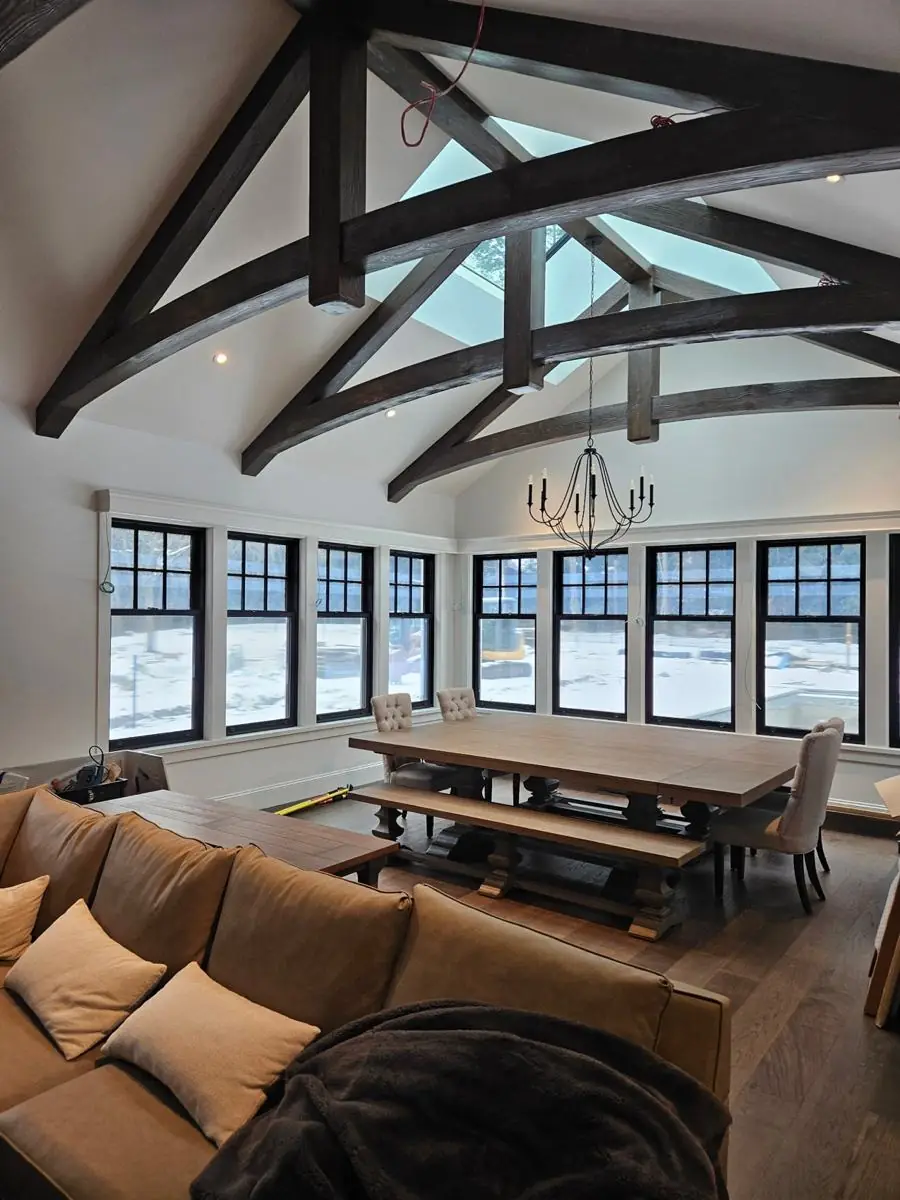 Great room with finished hardwood flooring and trim
